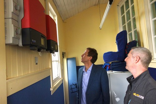Jon King from Solar King shows Green Party Co-Leader Russel Norman Peria School's new inverters